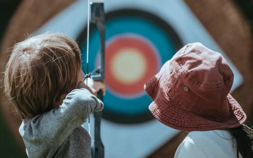 two children practising archery, a sunnah academy of sports archery course